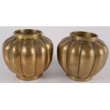 A pair of Chinese polished bronze vases, each with a fluted body and Xuande seal mark to base,