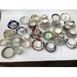 A selection of 18th and 19th century porcelain cups and saucers, including Coalport, Derby, Newhall,
