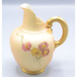 A Royal Worcester blush ivory jug, with floral decoration and fluted gilt handle, RD No.