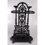 A cast iron black painted stick stand, height 53cm, width 33cm.