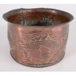 A copper planter repousse decorated with stylised fish, height 10.5cm, diameter 18cm.