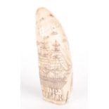 A reproduction scrimshaw whale's tooth, inscribed 'Ship Tamar', height 15cm, width 5.5cm.