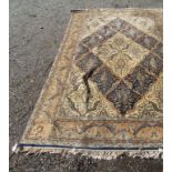A Persian design carpet, with Islamic script cartouche to one end,