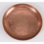 A Newlyn copper circular tray, decorated with a stylised fish amongst seaweed, impressed mark,