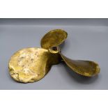 A brass propeller, impressed initials GC, also L6 HYDELL and D4865 LH, other indistinct marks,