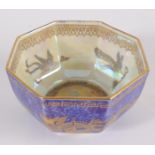 A Wedgwood lustre octagonal bowl, early 20th century, the blue exterior with gilt dragon decoration,
