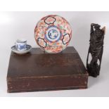 A Chinese export porcelain blue and white cup and saucer, height 7cm, a Chinese carved wood figure,