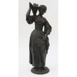 A French bronze statue of a lady gardener, 19th century,