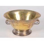 An early parcel gilt bowl with chased scrolling twin handles, diameter 9 cm, height 4.