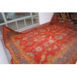 A Ushak carpet, the madder field with an all over design of palmettes,