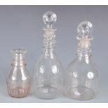 Two cut glass decanters, 19th century, both with a target stopper and three ring neck,