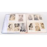 An album containing photographs of film stars from the mid 20th century, many signed,