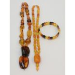 Two 'amber' necklaces 108g.