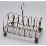 A silver toast rack with lion paw feet, 7oz.
