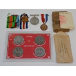 A 'Bundles For Britain' pin with a Union Jack box, together with medals and coins.