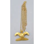 A very high purity gold bird pendant on 14ct gold chain 7.4g.