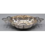 An 18th century German lobed silver oval brandy bowl with bow tied ribbon handles, 100g,