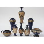 Eight items of Doulton stoneware, including a pair of baluster vases, height 19.5cm.