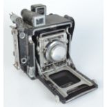 A Graflex Speed Graphic camera, with a 105mm Kodak Ektar lens.