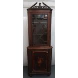A George III style inlaid mahogany standing corner cupboard with satinwood crossbanding throughout,