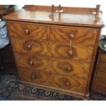 A Victorian chest of drawers, the front with figured elm mirrored veneers,