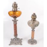 Two oil lamps, 20th century, heights 49cm and 37cm.
