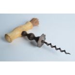 A Georgian Henshall type button corkscrew, with a turned bone handle and brush, length 15.