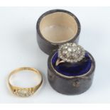 An 18ct gold ring set five diamonds, together with a gold ring set a white stone cluster.