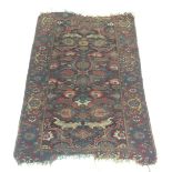 A Fereghan rug, the brown field with large palmettes and foliage,
