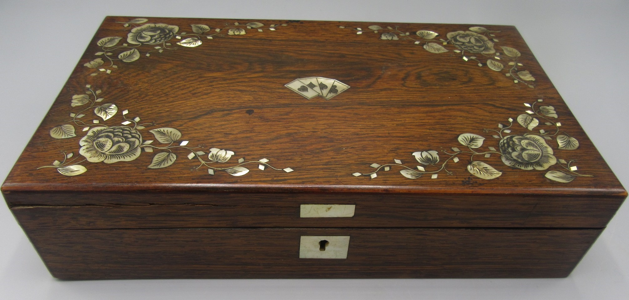 A rosewood and mother of pearl inlaid games box, early 20th century,