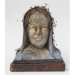 A French carved wood bust of a hooded woman, height 36cm, width 32cm, depth 20cm.