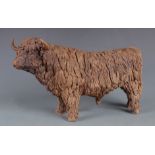 A studio pottery model of a yak, inscribed MC to the underside, height 17.5cm, length 33cm.