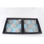 Ten toothpaste pot lids, within two square glazed display cabinets.
