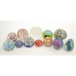 Twelve various glass paperweights, including two Caithness.