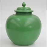 A Ruskin bulbous lidded vase, with a plain green glaze, no 1913, height 30cm, diameter 25cm.