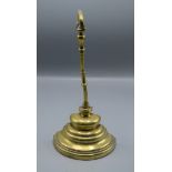 A brass, lead filled dooorstop, 19th century, height 33cm, width 15.5cm.