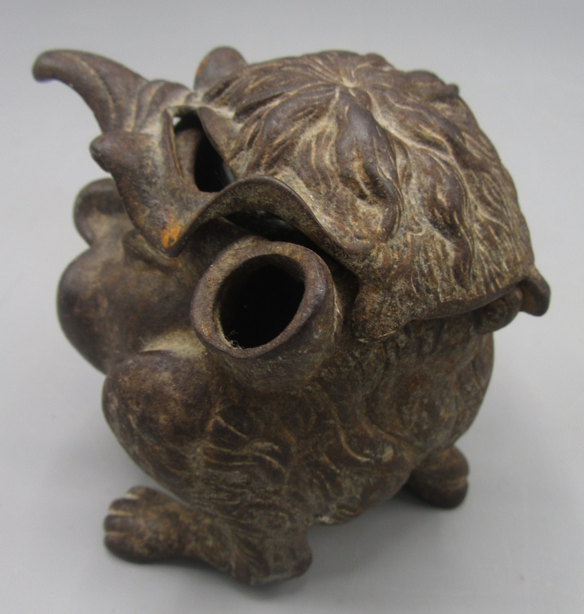 A cast iron inkwell in the form of a gargoyle, with glass liner, height 7.5cm, width 6.5cm, depth 8. - Image 3 of 3