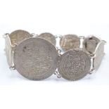 A silver coin bracelet.