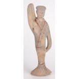 A South East Asian painted earthenware figure of a lady, height 38.5cm, width 12cm.