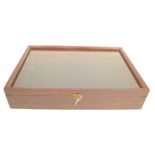 A mahogany glazed display case, height 9.5cm, width 46.5cm, depth 31.5cm.