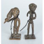 Two Ashanti bronze gold weights, in the form of tribal figures, heights 6.2cm and 5.5cm.