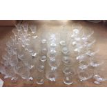 A extensive collection of cut glassware, comprising six wine glasses, height 17cm, five tumblers,