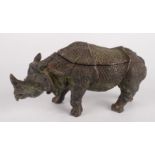 A cast metal inkwell, early 20th century, in the form of a rhinoceros, height 11cm, width 21cm.