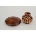 A birds eye maple circular shallow box and cover, height 4cm, diameter 17cm and a wooden vase,