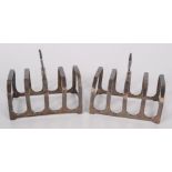 A pair of pre-war four section silver toast racks, 3oz.