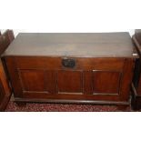 An oak coffer, 17th century, with single panel sides and a triple panel front on stile feet,