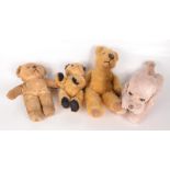 A Cragstan Japan clockwork poodle, height 18cm, length 29cm and three teddy bears, heights 22cm,