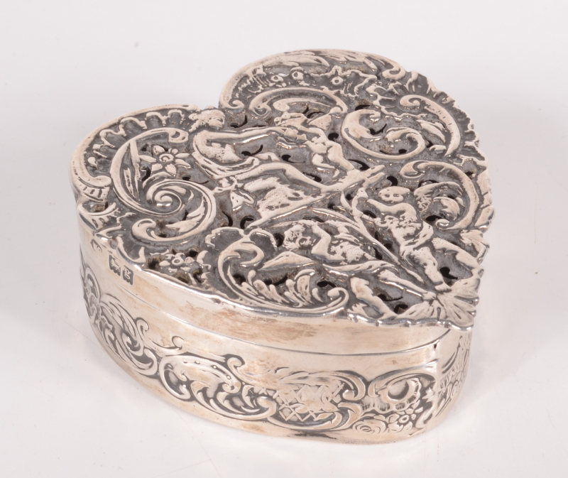 A William Comyns heart shaped box with cast pierced lid and embossed sides, London 1902, 2.