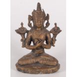 A South East Asian gilt bronze figure of a seated deity, 19th century, height 16cm, width 11cm,