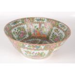 A Chinese famille rose punch bowl, 19th century, decorated with figures, flowers and birds,